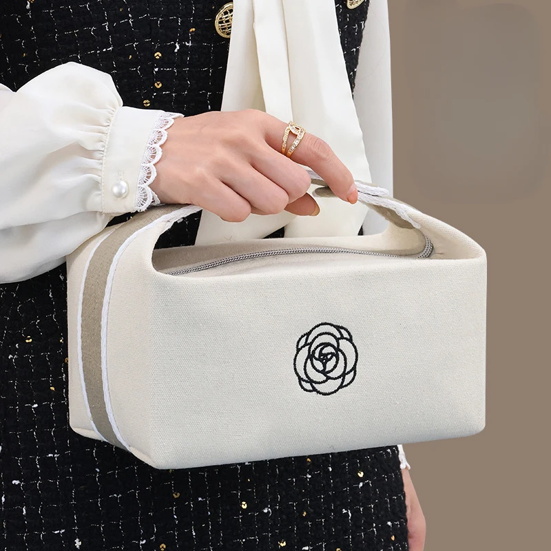 Bolsa de maquiagem portátil de lona de camélia premium para viagens, produtos de higiene pessoal de grande capacidade, cosméticos, bolsa de armazenamento de cuidados com a pele