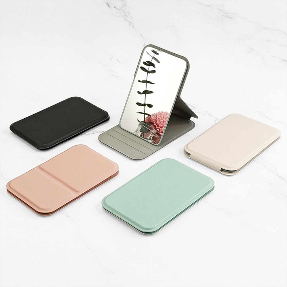 Mini espejo de maquillaje plegable para mujer, espejo de maquillaje de viaje de mano, espejo de bolsillo antideslizante de cuero portátil, escritorio con mango de Color sólido