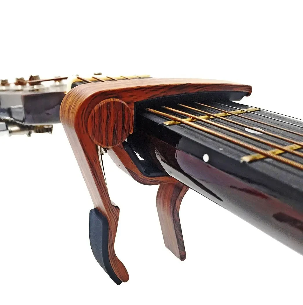 Capotasto per chitarra Miwayer per chitarre acustiche ed elettriche color palissandro con 5 plettri
