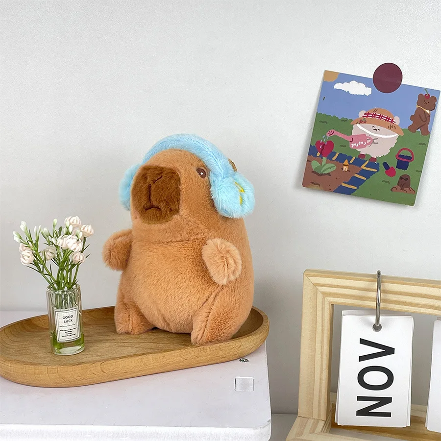 Lindo capibara con auriculares juguete para niños cubierta para la cabeza muñeca capuibala llavero colgante suave muñeco de peluche pareja llavero regalo