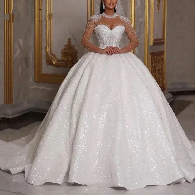 Abiti da sposa africani scintillanti personalizzati 2024 Abito da ballo di lusso Perline glitterate Paillettes Maniche lunghe Abito da sposa sexy Dubai