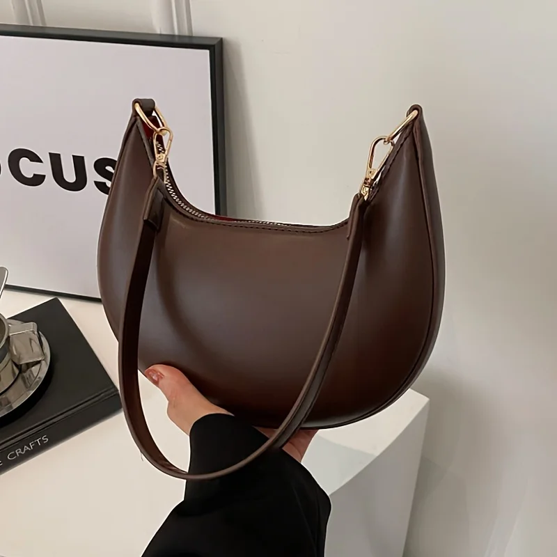 Bolsa de ombro feminina nova moda high-end em forma de lua bolsa de beisebol mostrando luxo bolsa de ombro único feminina