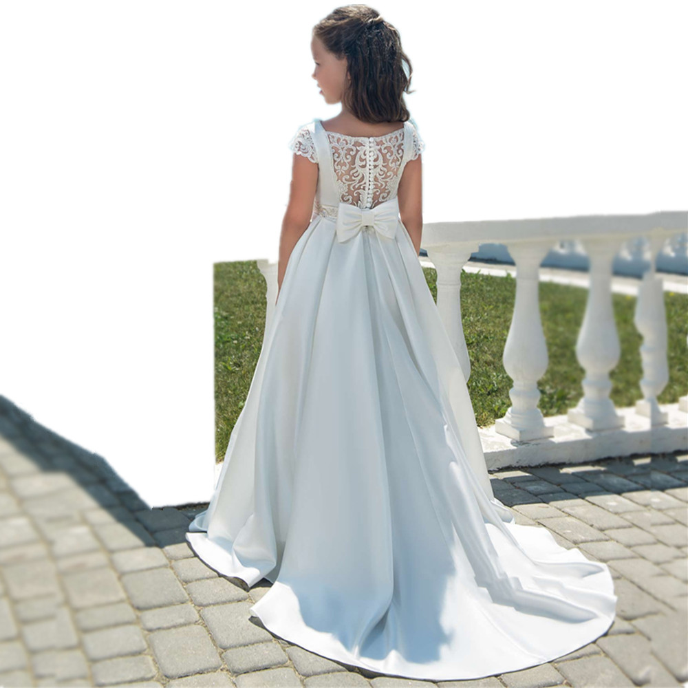 Perlen Blumenmädchenkleider für die Hochzeit Modisches Festzugskleid Ärmellose Spitzenapplikationen Kleider für die heilige Kommunion für Mädchen