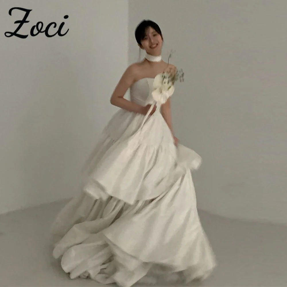 Zoci Elegant Strapless ชุดแต่งงานเกาหลีถ่ายภาพที่กําหนดเอง Ruched ฉัตรชุดเจ้าสาวเปิดด้านหลังความยาวชั้นชุดเจ้าสาว