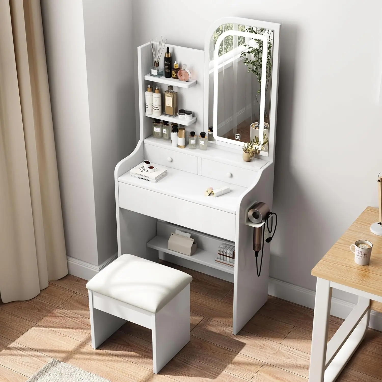 A small dressing table with power socket, a mini white dressing table with mirror and light, and a stool