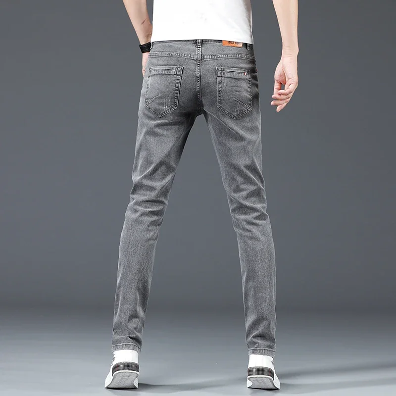 2024 nuevos pantalones vaqueros ajustados informales de negocios de algodón para hombres pantalones vaqueros ajustados rectos elásticos a la moda para hombre azul gris