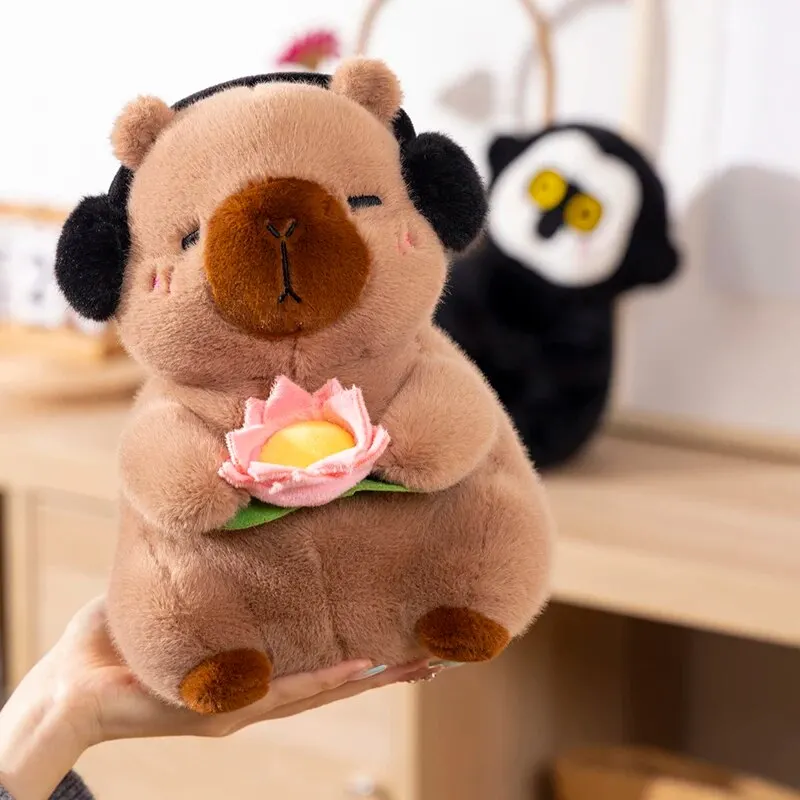 1 ชิ้นใหม่น่ารัก Capybara ตุ๊กตาของเล่นตุ๊กตาสัตว์ Capybara ตุ๊กตานุ่มถือดอกไม้ของเล่นเด็กของขวัญวันเกิด