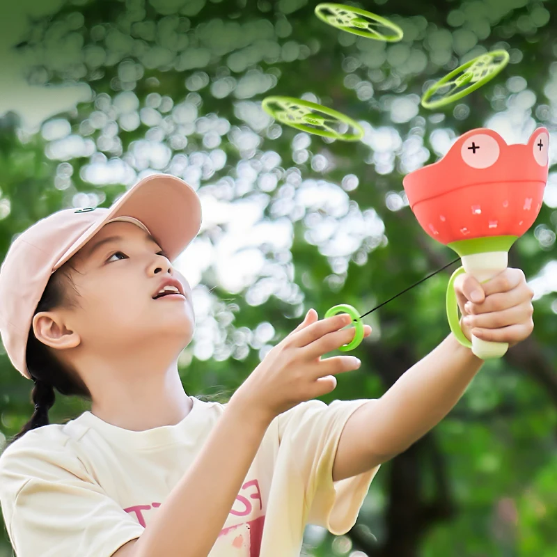 ดึง String Flying Saucer Disc Launcher เด็กของเล่นโยนจับกีฬากลางแจ้งใบพัดเด็กสวนเกมของขวัญ Boy