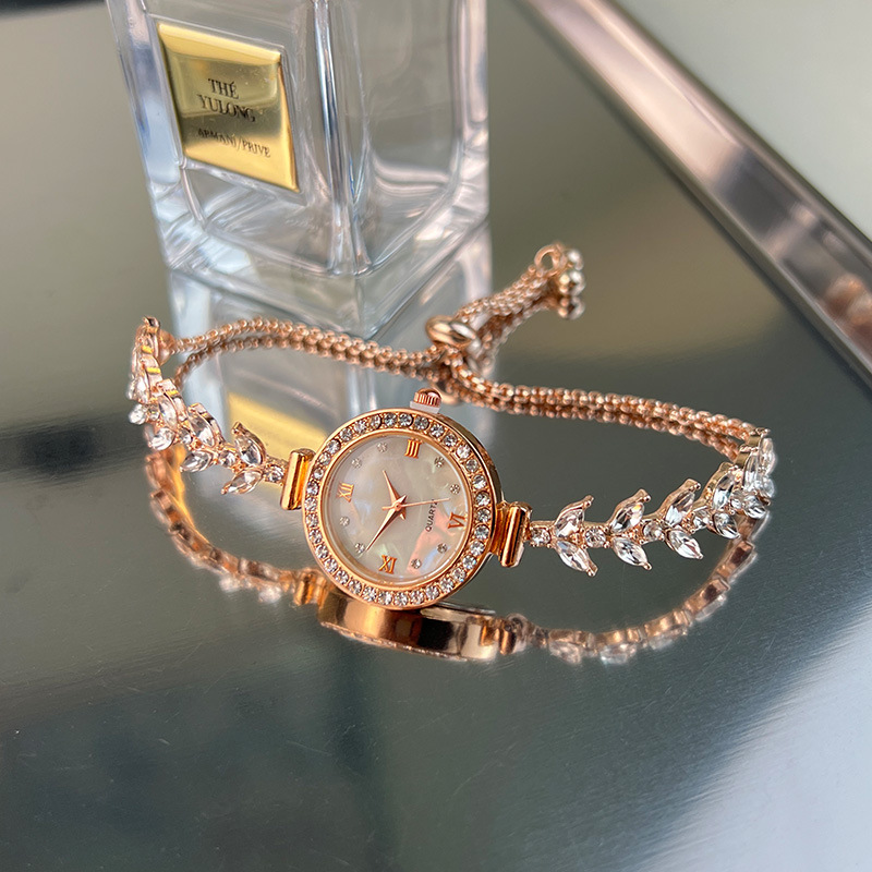 Reloj UTHAI para mujer, cadena de sirena, pulsera de ajuste libre de diamantes de lujo ligera, relojes de cuarzo de moda para mujer Beimu dorados