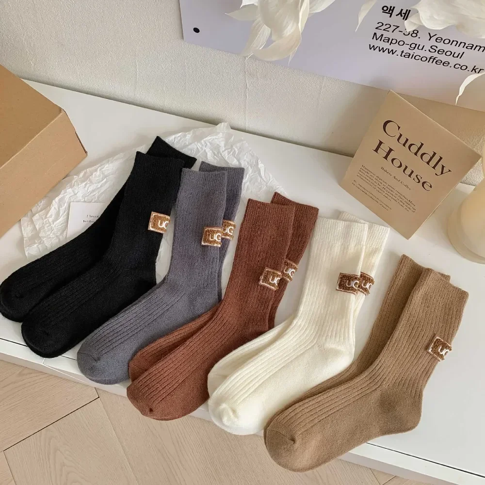 Ins กลางหลอดกลางถุงเท้าอุ่นถัก Snow Boot ถุงเท้าสีทึบส้น Furry ป้ายถุงเท้าผู้หญิงฤดูหนาว