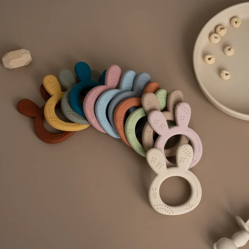 ソフトシリコーンおしゃぶり赤ちゃん漫画ウサギの形感覚歯が生えるおもちゃ BPA フリー幼児咀嚼臼歯おもちゃベビーアクセサリー