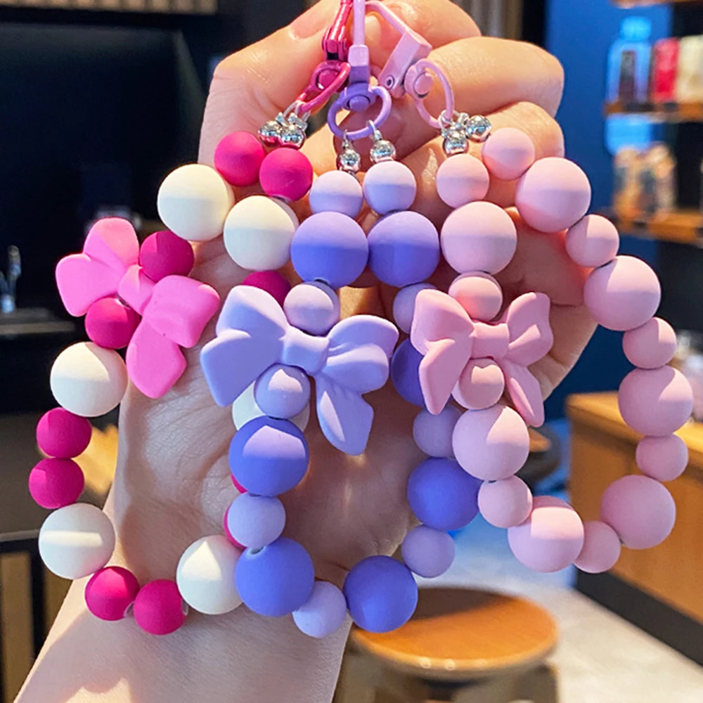 Llavero con lazo de perla rosa, cadena para teléfono móvil, bolsa para auriculares, cuerda antipérdida, llavero para coche, colgante con cuentas, acceso colgante para mochila