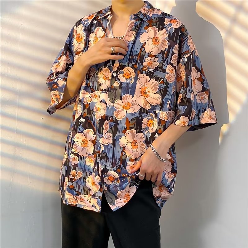 Camicia quotidiana estiva da uomo alla moda di strada Camicie larghe casual con stampa di cartoni animati hawaiani Top larghi da spiaggia a maniche corte