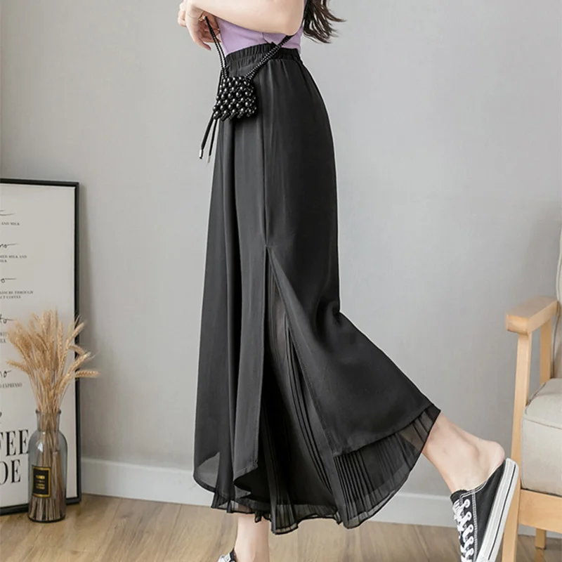 Calça elástica de perna larga feminina, culottes irregulares de bainha, camada dupla, calça coreana casual solta plissada de verão