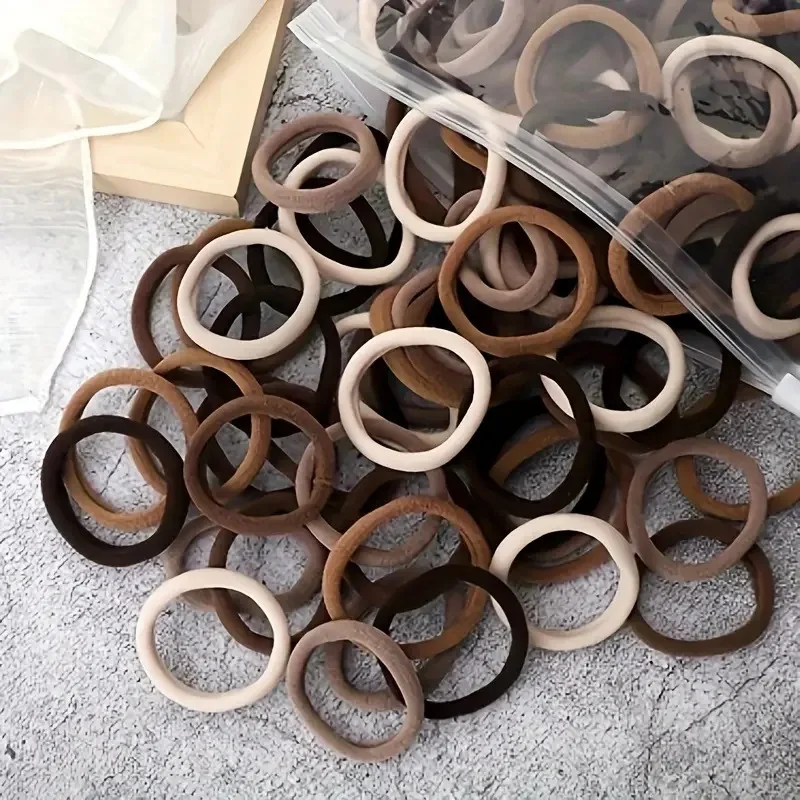 Muitas pessoas como a corda de cabelo de alta elasticidade 100 peças de várias cores corda de anel de cabelo sem costura.