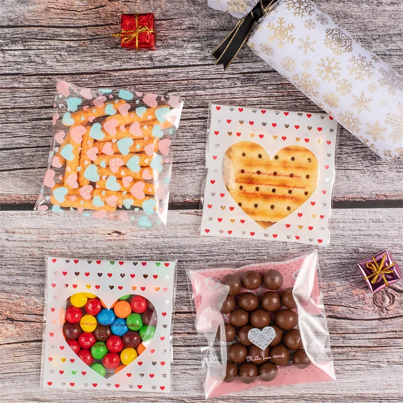 100pcs 7x7/10x10 ซม.หัวใจพลาสติก CELLO กระเป๋าปิดผนึกด้วยตนเองสําหรับ DIY คุกกี้ขนมขบเคี้ยวแพคเกจตกแต่งขนาดเล็กธุรกิจ