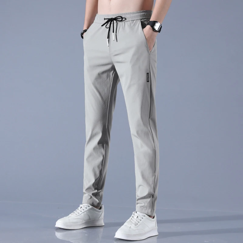 Pantaloni da uomo in seta di ghiaccio 2025 Estate Nuovo Nero Grigio Pantaloni casual da lavoro sottili Pantaloni sportivi a gamba dritta traspiranti elastici all'aperto