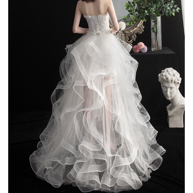 Nieuwe voorkant korte lange achterkant strapless trouwjurk zoete bruidjurk