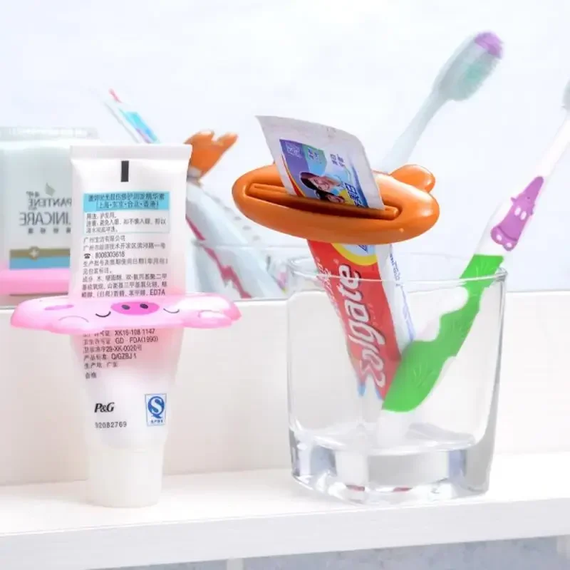 สําหรับห้องน้ํา 1 ชิ้นสัตว์ง่ายยาสีฟันพลาสติกฟันหลอดยาสีฟัน Squeezer Rolling ผู้ถือ Cocina