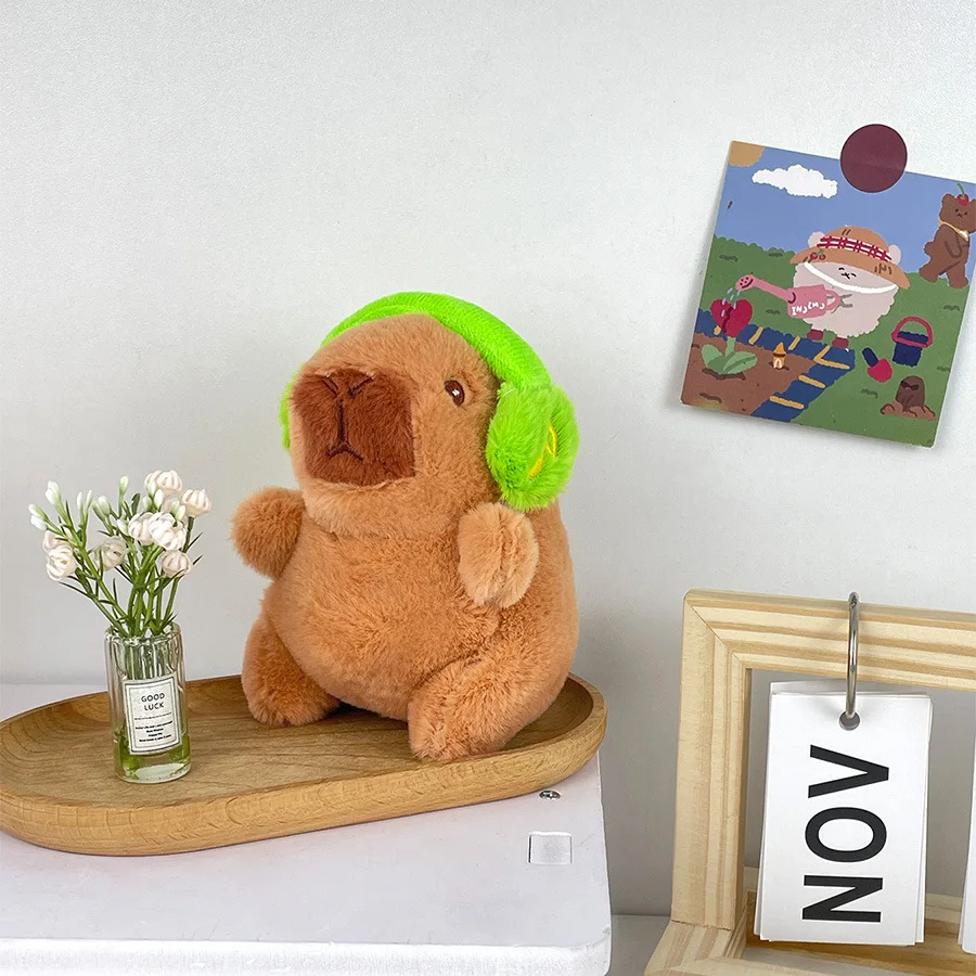 Lindo capibara con auriculares juguete para niños cubierta para la cabeza muñeca capuibala llavero colgante suave muñeco de peluche pareja llavero regalo