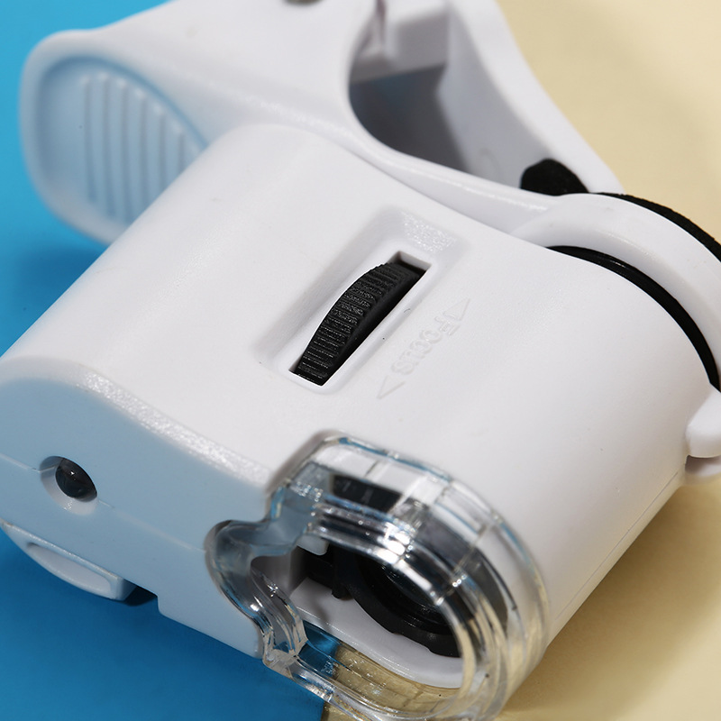 Universal Clip กล้องจุลทรรศน์ 60X LED เครื่องประดับแว่นขยายโฟกัสปรับกล้องจุลทรรศน์พ็อกเก็ตพร้อมคลิปโทรศัพท์มือถือ UV Light