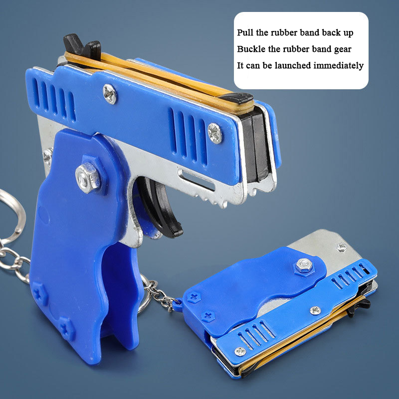 1pc ミニゴムバンド銃キーホルダー合金金属折りたたみランチャーおもちゃ 60 ゴムバンド屋外キャンプパーティーギフト男の子男性のため