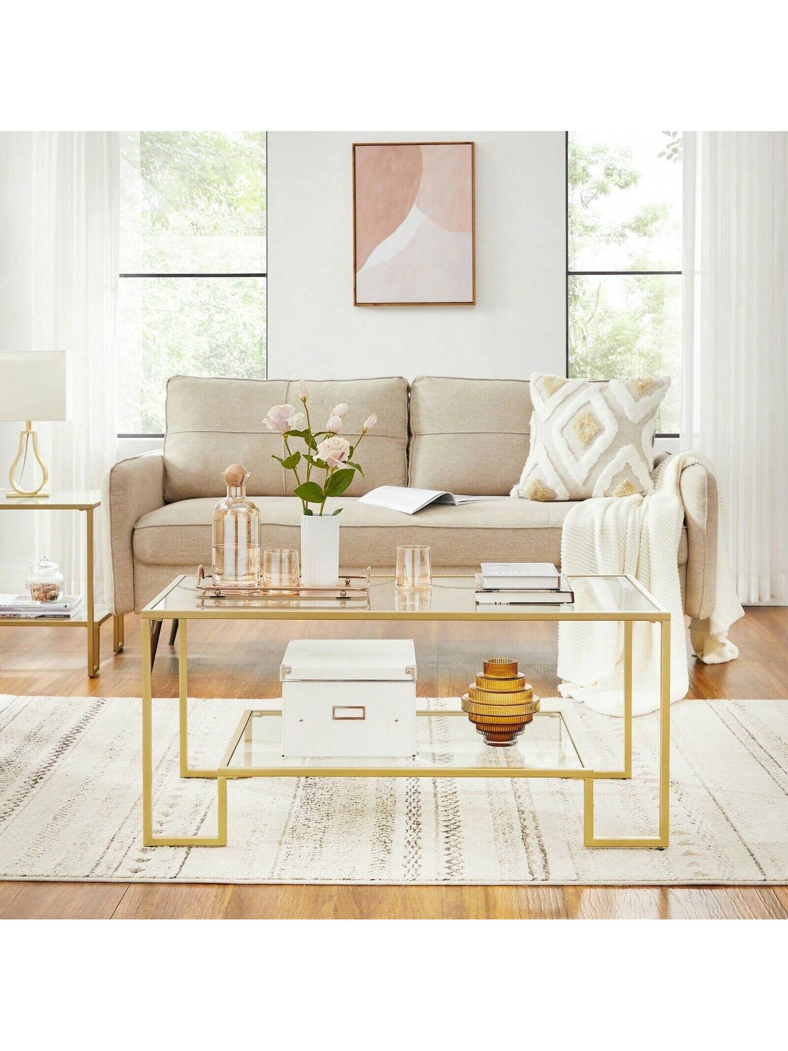 Mesa de centro de vidrio VASAGLE con almacenamiento Superficie de vidrio templado, marco de acero 100x55x45 cm, Color dorado