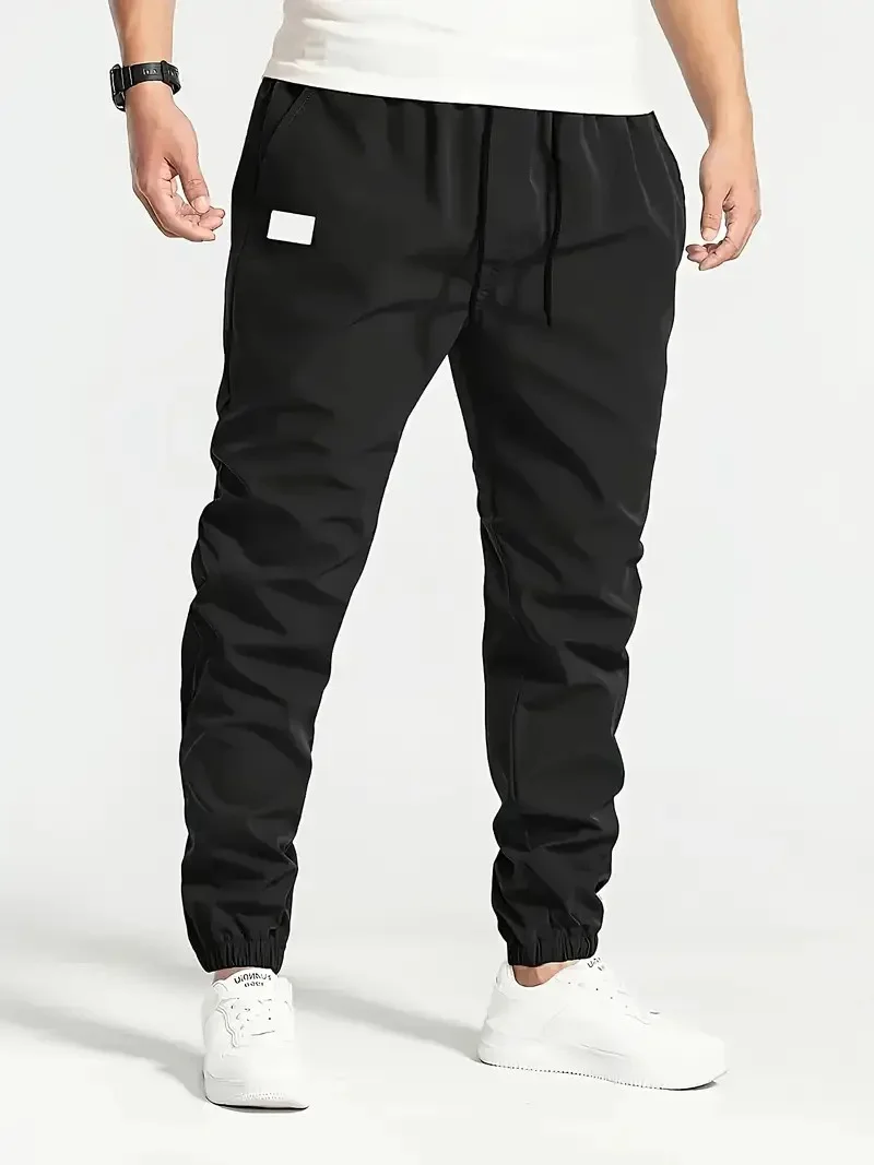 2025 NUOVA Primavera Autunno Pantaloni da uomo slim sportivi Pantaloni da jogging casual Pantaloni da uomo in tinta unita Pantaloni sportivi giornalieri in tessuto sottile