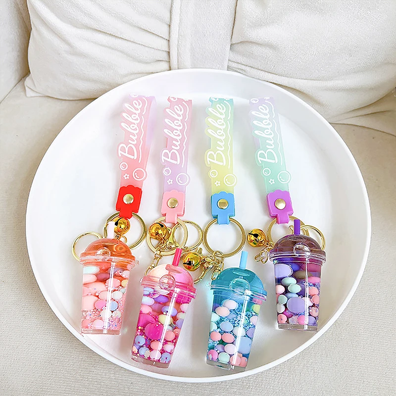 Tasse à thé au lait avec perle liquide mignonne, clé d'astronome, porte-clés Creative Quicksand, pendentif de sac à dos, cadeau porte-clés, MSI flottante, JOCreative