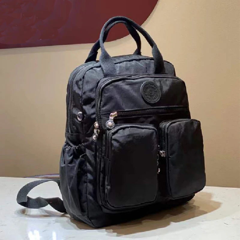แฟชั่นผู้หญิงกระเป๋าเป้สะพายหลังไนลอนกันน้ํา Soft Handle Solid Multi-pocket Travel Zipper Feminina กระเป๋าแล็ปท็อปกระเป๋าเป้สะพายหลัง