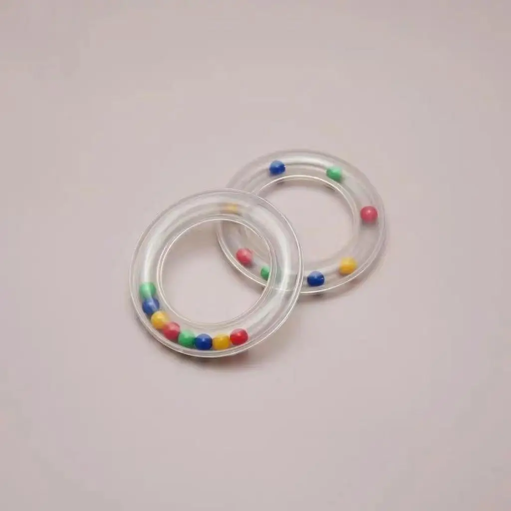 赤ちゃんと子供のためのプラスチック製のrattleラウンドリング,色付きのビーズ,ノイズメーカー,感覚トレーニング玩具,美しい教育