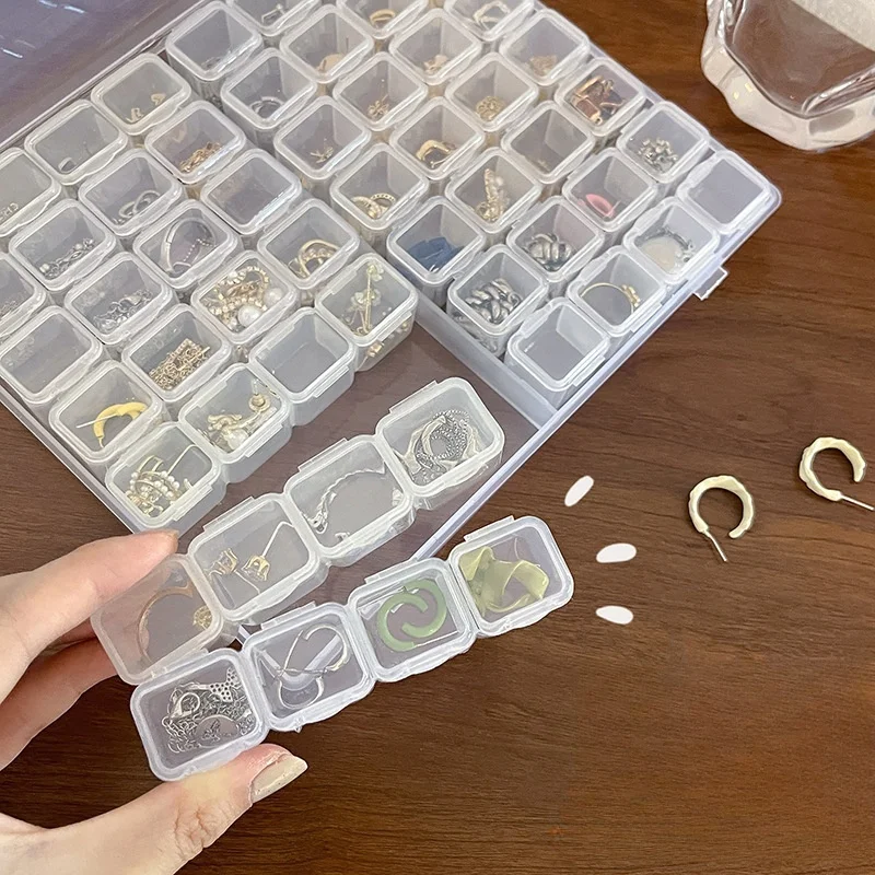 กล่องใส่เครื่องประดับสําหรับเดินทางแบบใสพร้อมดีไซน์ป้องกันการเสื่อมเสีย |   ช่องปรับได้สําหรับสร้อยคอ ต่างหู แหวน |   แบบพกพาT