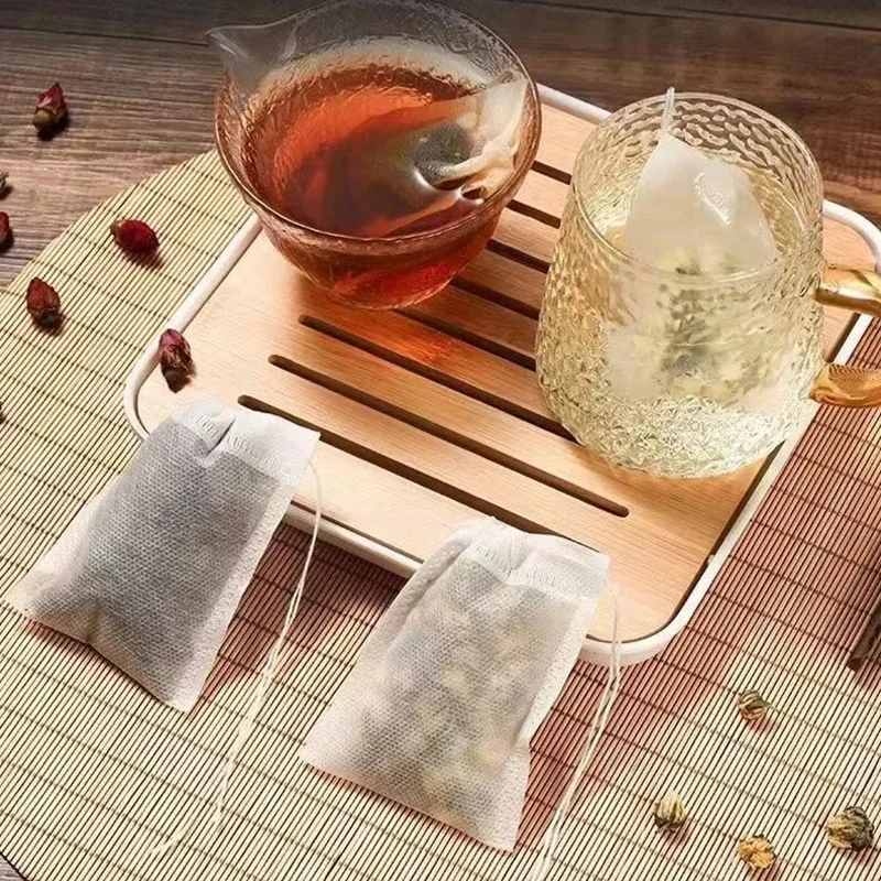 100 ชิ้นถุงชาแบบใช้แล้วทิ้งถุงกรองสําหรับชา Infuser กับ String Heal Seal เกรดอาหารไม่ทอผ้าเครื่องเทศตัวกรอง Teabags