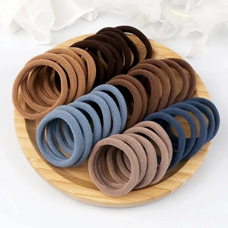 Muitas pessoas como a corda de cabelo de alta elasticidade 100 peças de várias cores corda de anel de cabelo sem costura.