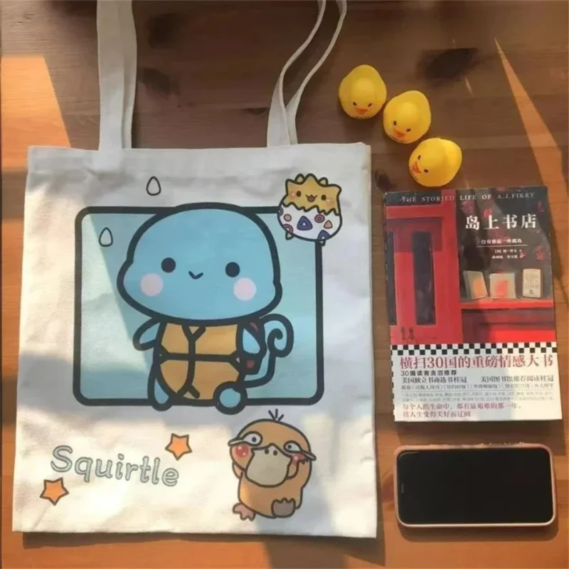 Torba na ramię z płótna o dużej pojemności z motywem anime Pokemon Pikachu, Psyduck, Squirtle, damska torba codzienna, torba na zakupy wielokrotnego użytku.