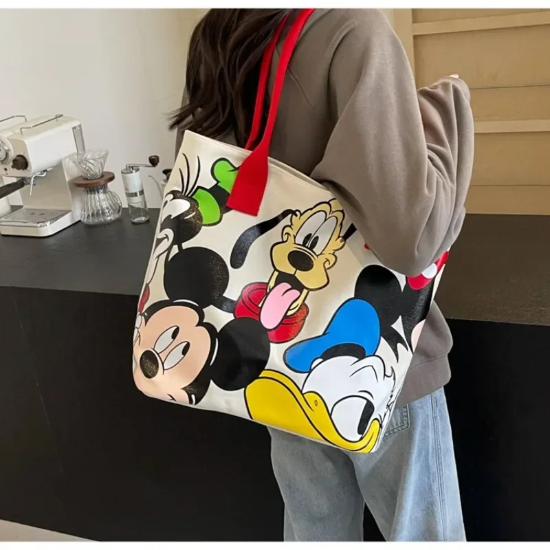 Bolso de lona versátil de gran capacidad con dibujos de Mickey para mujer, bolso de mano informal y versátil, bolso de clase para estudiantes
