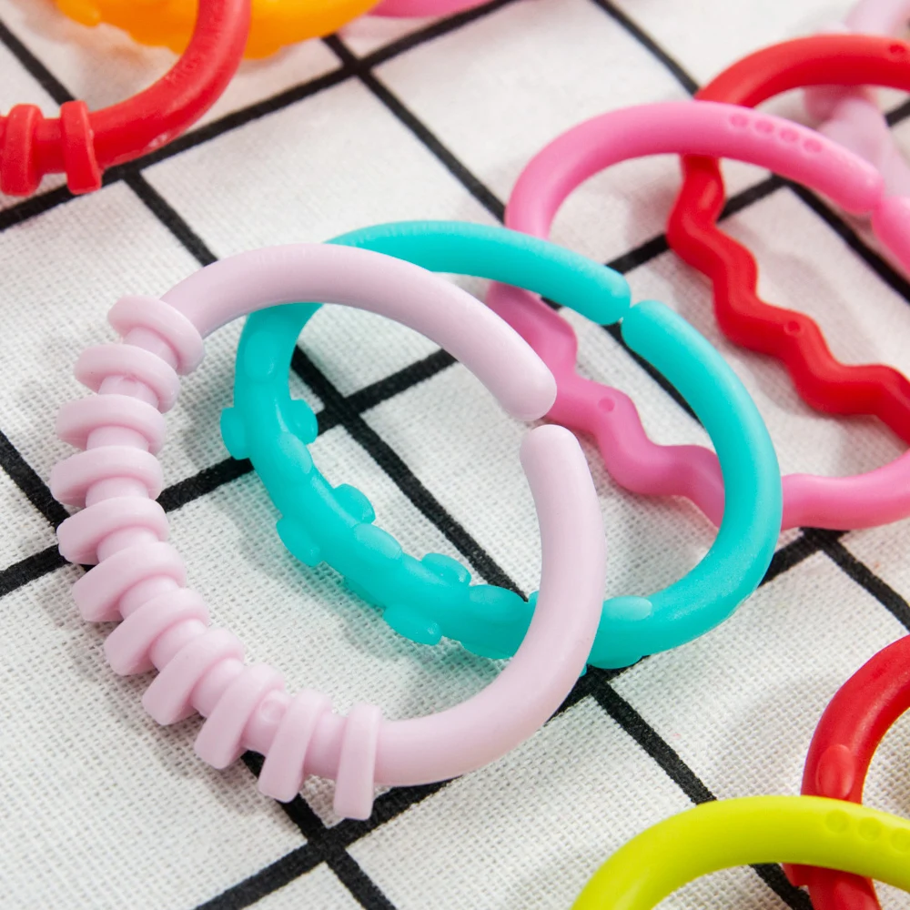 8pcs Baby Teether Rattles ของเล่น Chew ของเล่นสําหรับทารกแรกเกิดยางสายรุ้งแหวนความปลอดภัยของเล่นเด็กเปลรถเข็นเด็กแขวน