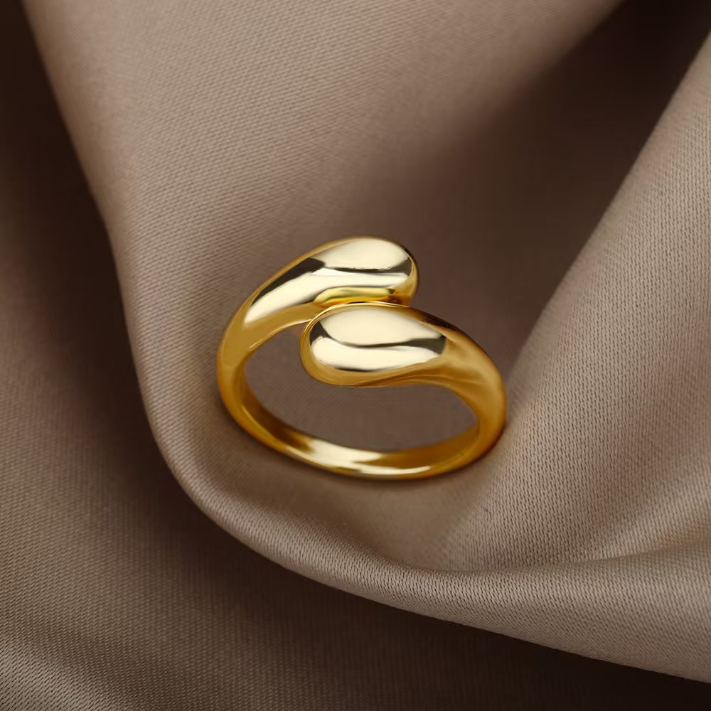 A ladies' stainless steel glossy double-ball open gold ring