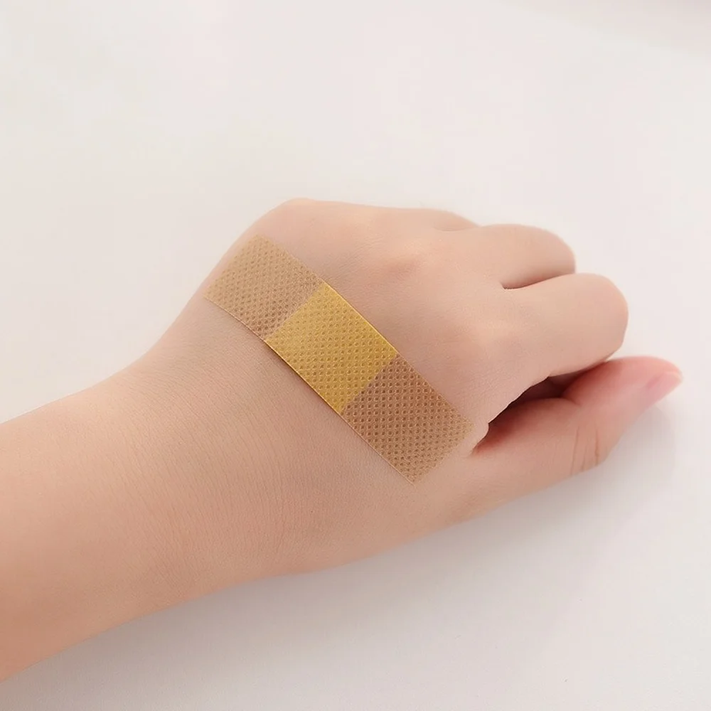 50pcs กันน้ําบาดแผลแพทช์เทป Self-Adhesive พลาสเตอร์ผ้าพันแผลผ้าไม่ทอ Band Aid สําหรับเด็ก
