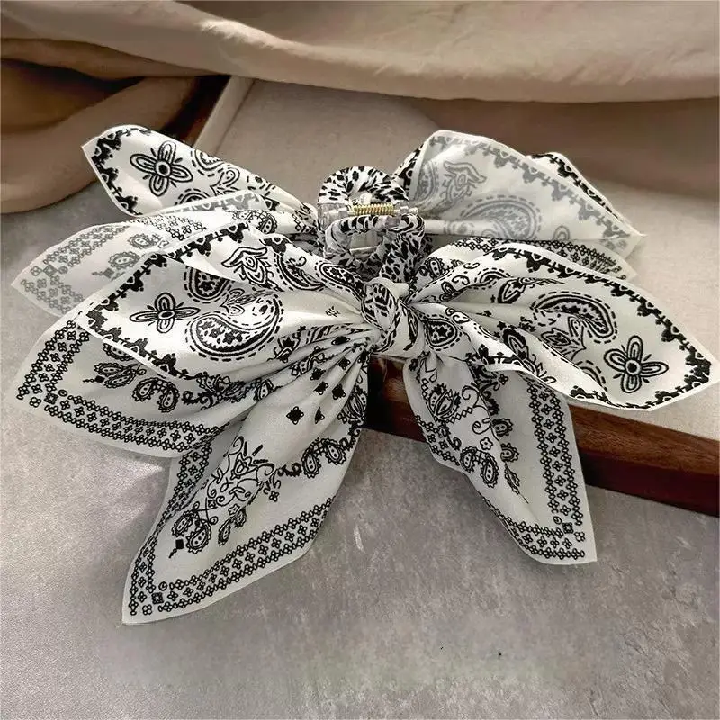 Accessori per capelli di fascia alta per donna con clip per fiocco su entrambi i lati in tessuto con stampa leopardata dal temperamento retrò