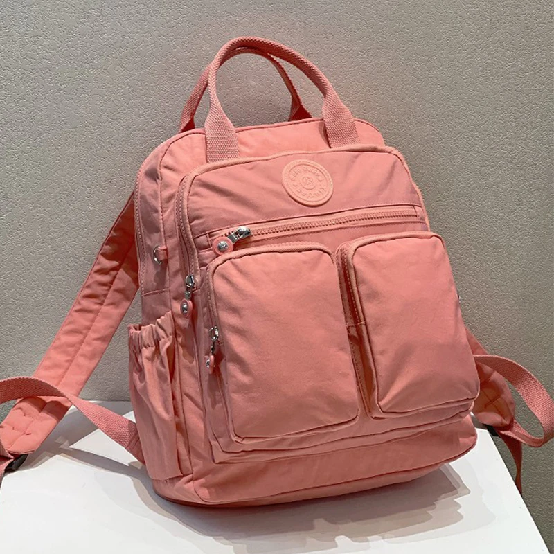 แฟชั่นผู้หญิงกระเป๋าเป้สะพายหลังไนลอนกันน้ํา Soft Handle Solid Multi-pocket Travel Zipper Feminina กระเป๋าแล็ปท็อปกระเป๋าเป้สะพายหลัง