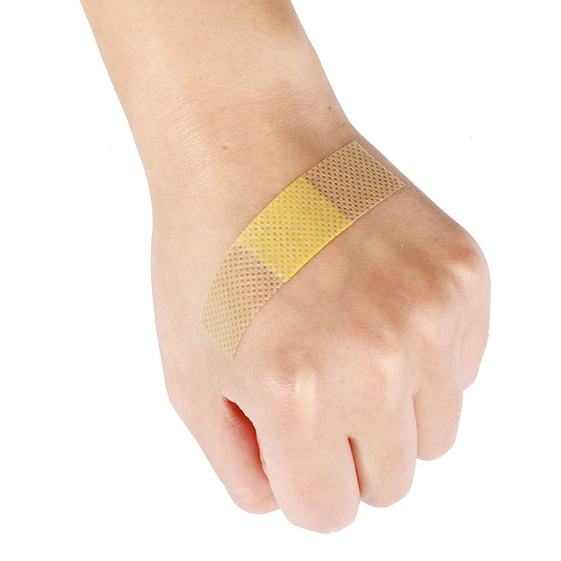 50 ชิ้น/แพ็ค Breathable Band Aid First Aid Wound Patch ผ้าไม่ทอบาดแผล Band เทปกาวผ้าพันแผลพลาสเตอร์