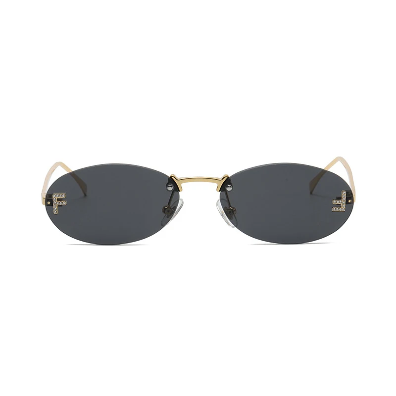 Moda sem aro óculos de sol feminino uv400 oval elegante diamante f óculos de sol retro