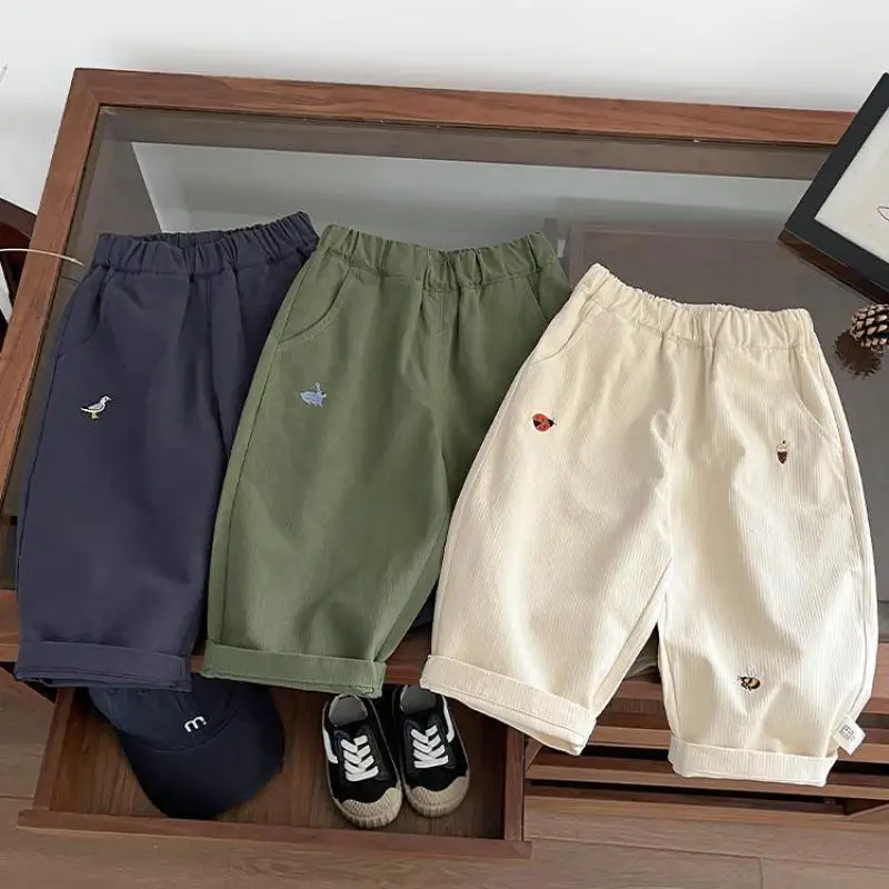 2025 otoño nuevos pantalones casuales para bebé bordado de dibujos animados moda niños pantalones versátiles pantalones sueltos para niña ropa para niños