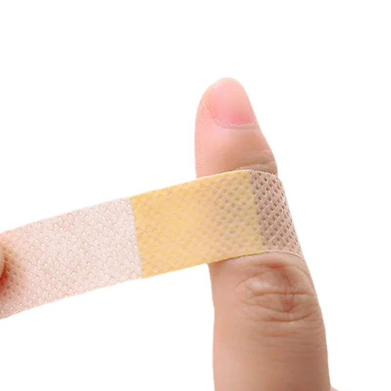 50pcs กันน้ํา First Aid Woundplast Breathable ผ้าพันแผลกาวทางการแพทย์เทปผ่าตัดบาดแผล Band Aid Sticking Plaster