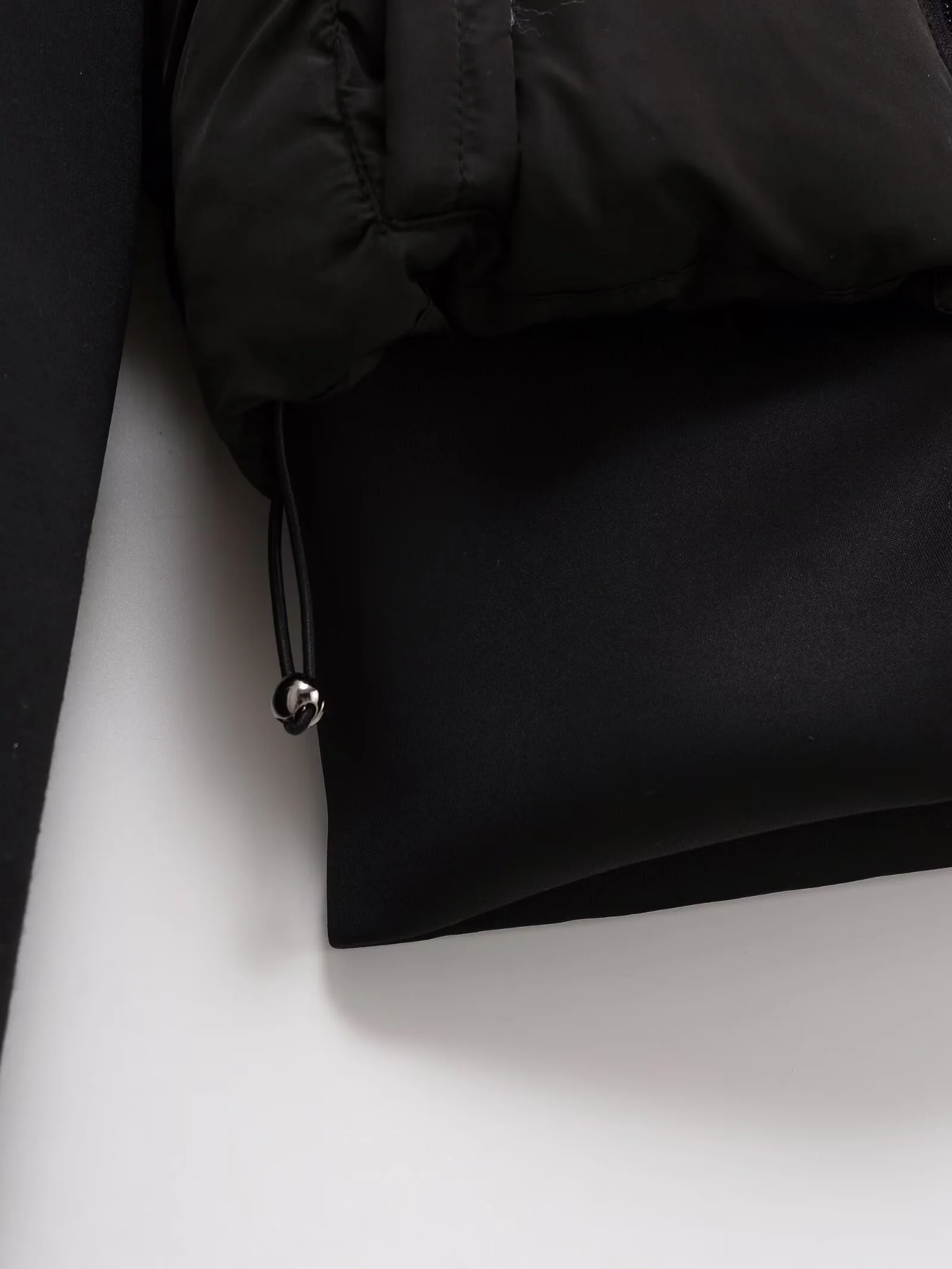 UNIZERA2025 outono nova moda casual feminina fino tecido elástico emenda casaco de algodão quente casaco de algodão com capuz