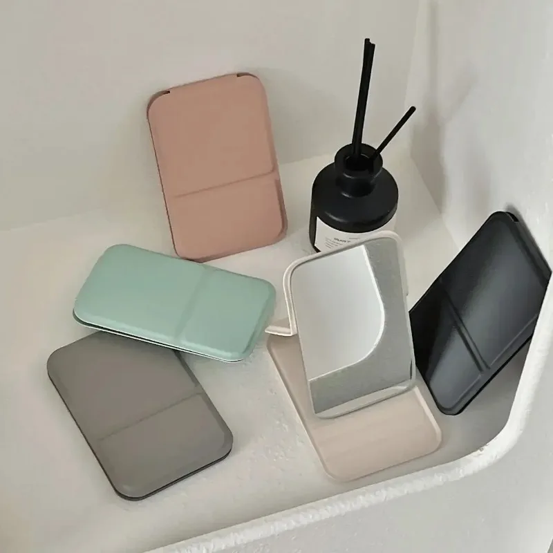 Specchio per il trucco da tavolo Specchio per il trucco portatile semplice in pelle PU tinta unita Specchio tascabile carino compatto per studenti pieghevole
