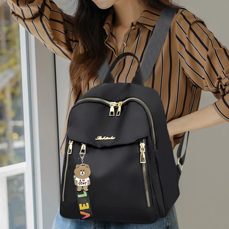 The Neutral Color Backpack with Both Shoulder Straps Is Suitable for Travel, as Well as for Carrying Accessories and Books