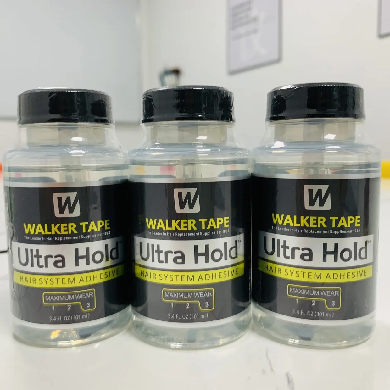 Venta al por mayor, cinta para caminar, pegamento para peluca de encaje Ultra Hold, adhesivo de encaje transparente impermeable para reemplazo de cabello, pegamento con cepillo