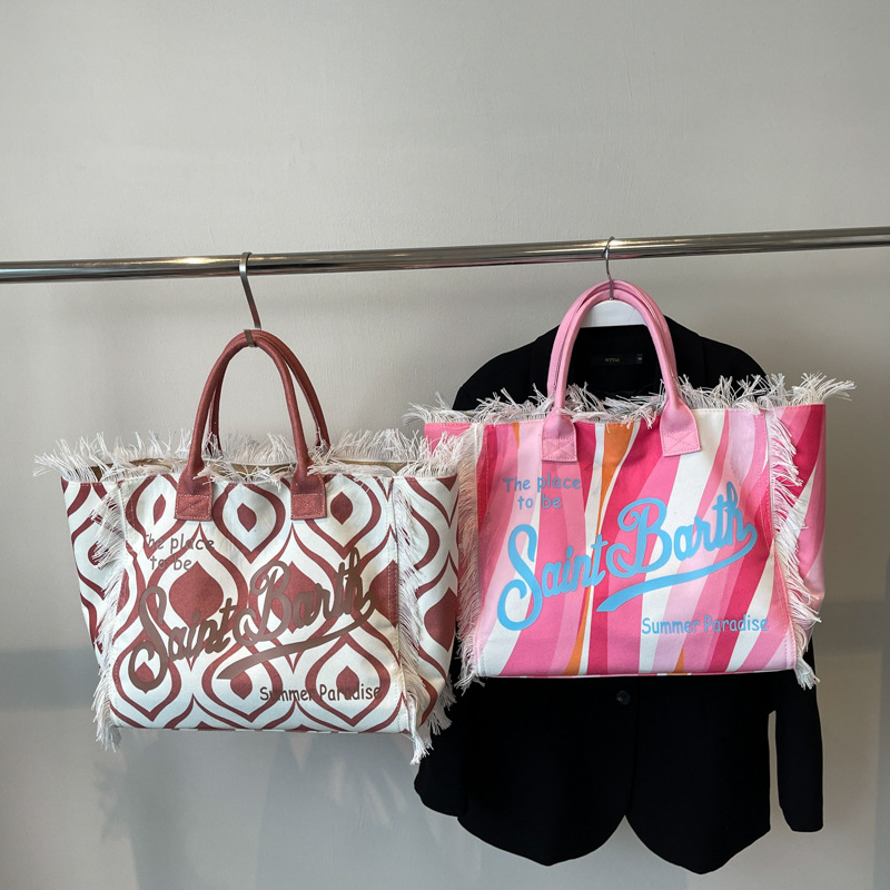 Bolso de mano de playa de gran capacidad con borlas a la moda, nuevo bolso de mujer de un solo hombro con letras con estampado de leopardo